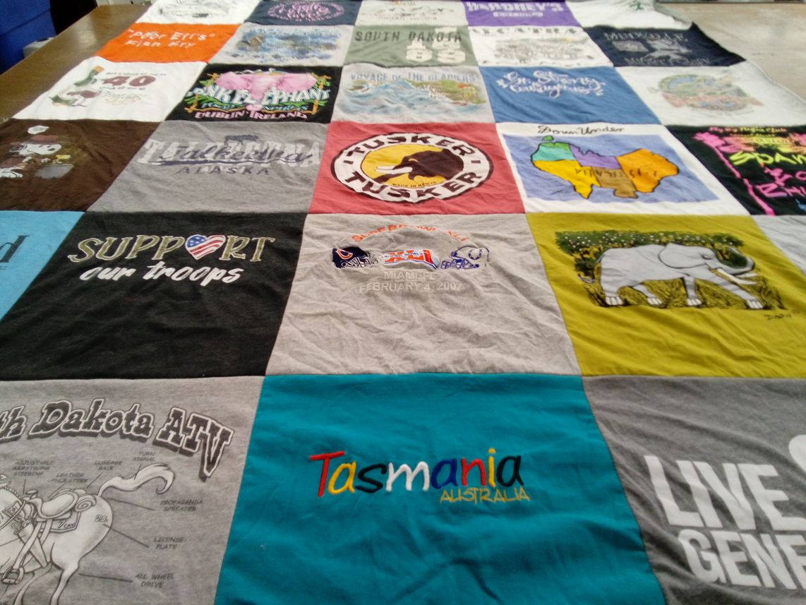 T-shirt quilt with travel, supporting troops themes by Pamela from FL