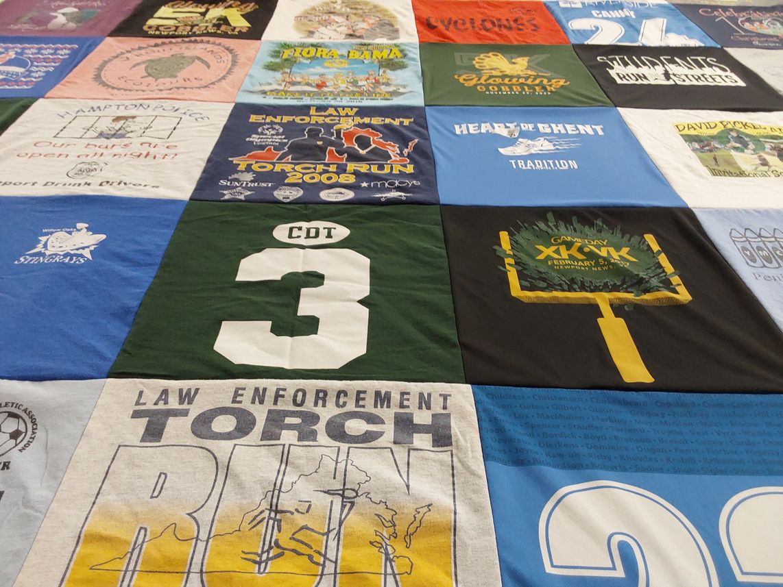 T-shirt quilt with law enforcement, community service themes by susan from VA
