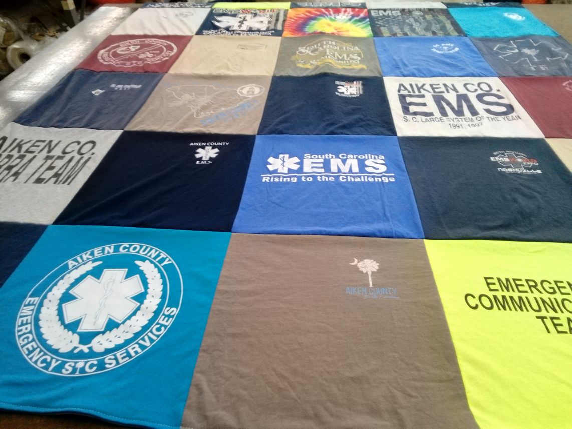 T-shirt quilt with emergency medical services, community service themes by Jane from SC