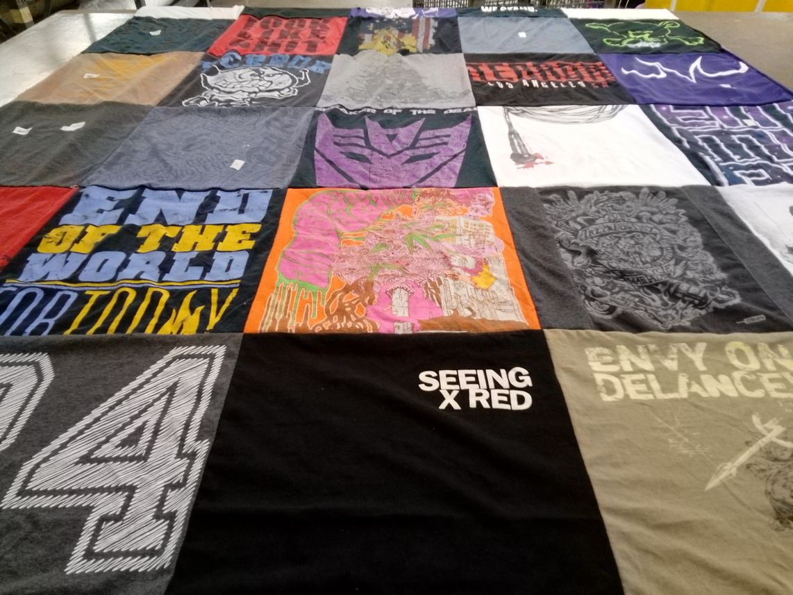 T-shirt quilt with art, music themes by Hope from SD