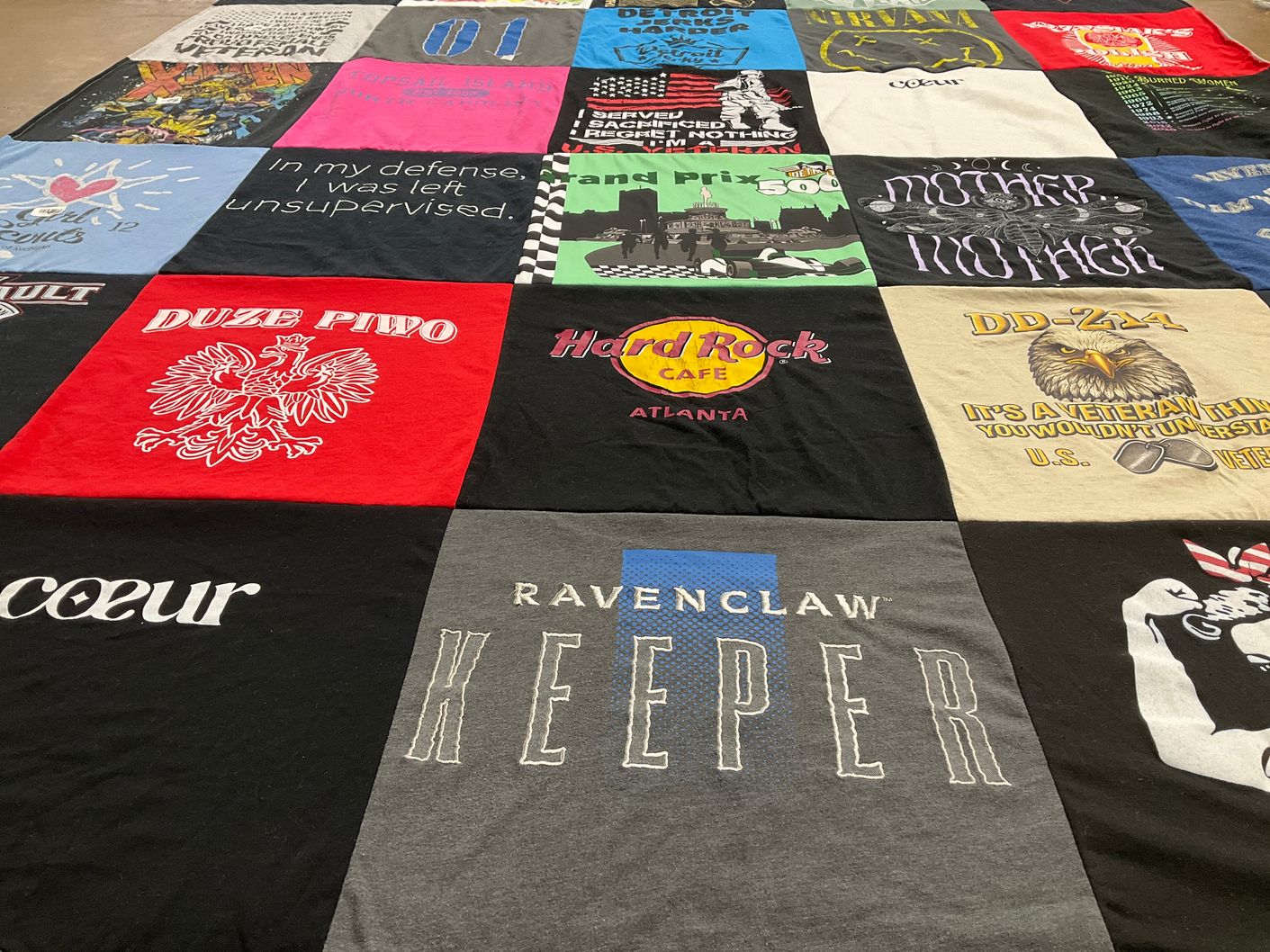 T-shirt quilt with veterans, music themes by Rebecca from MI