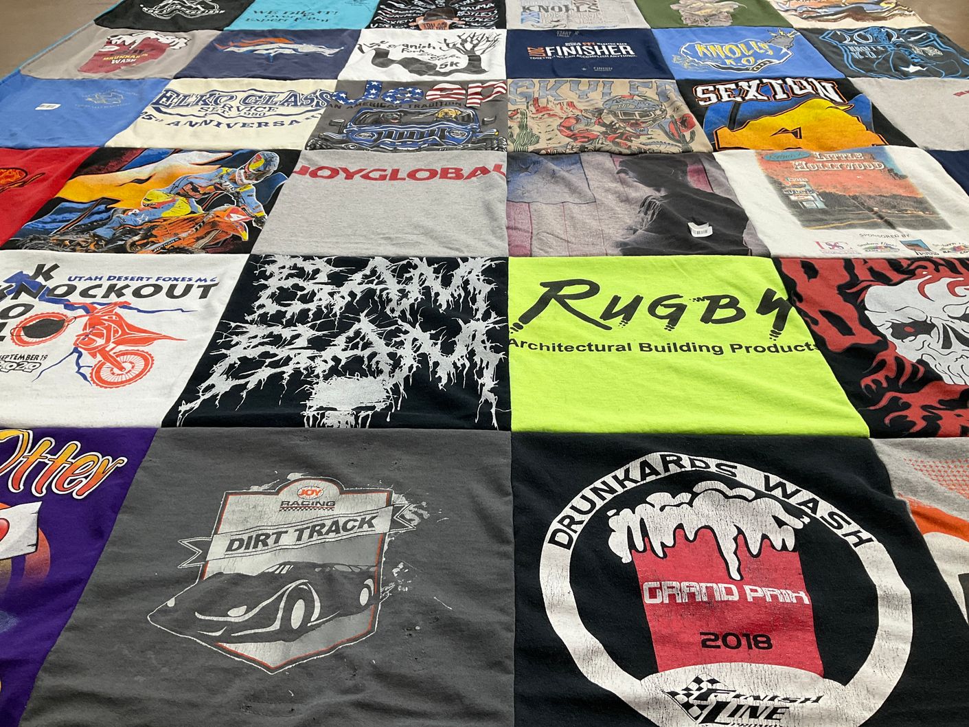 T-shirt quilt with motorsports, rugby themes by Leslie from UT