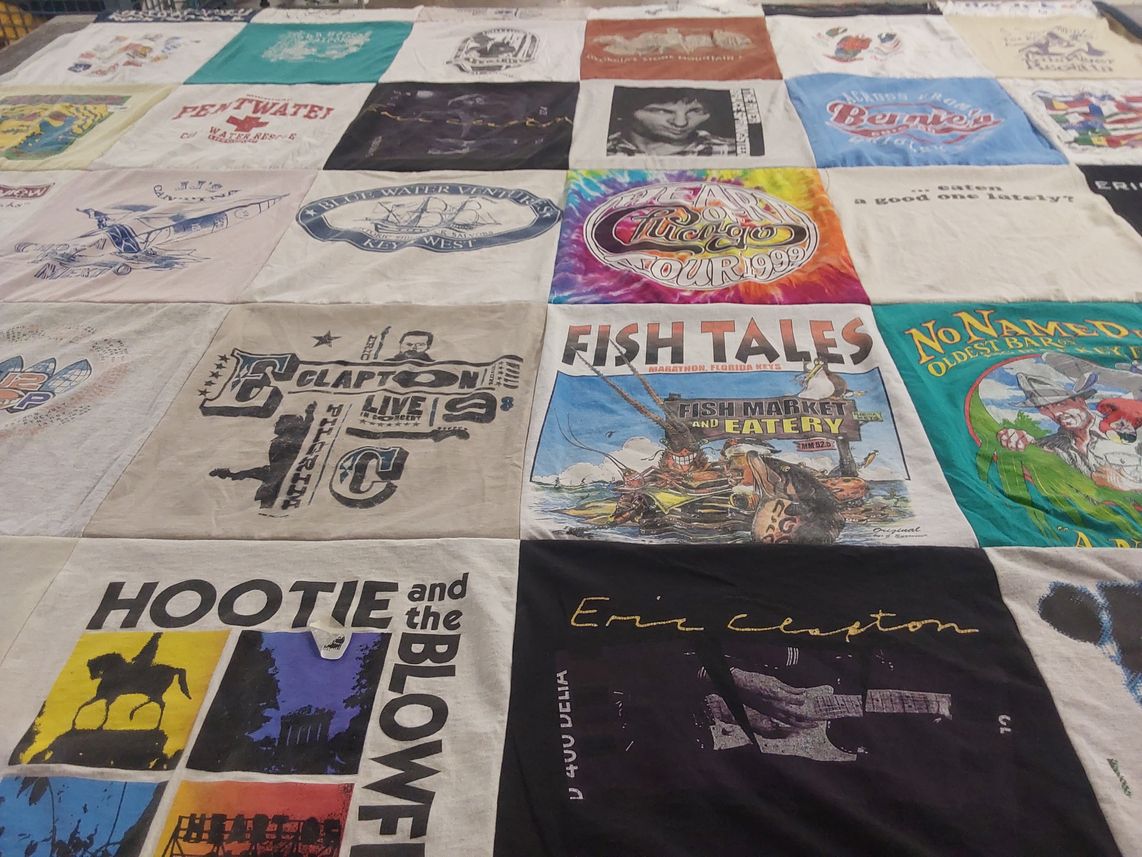 T-shirt quilt with music, fishing themes by Kathleen from IL