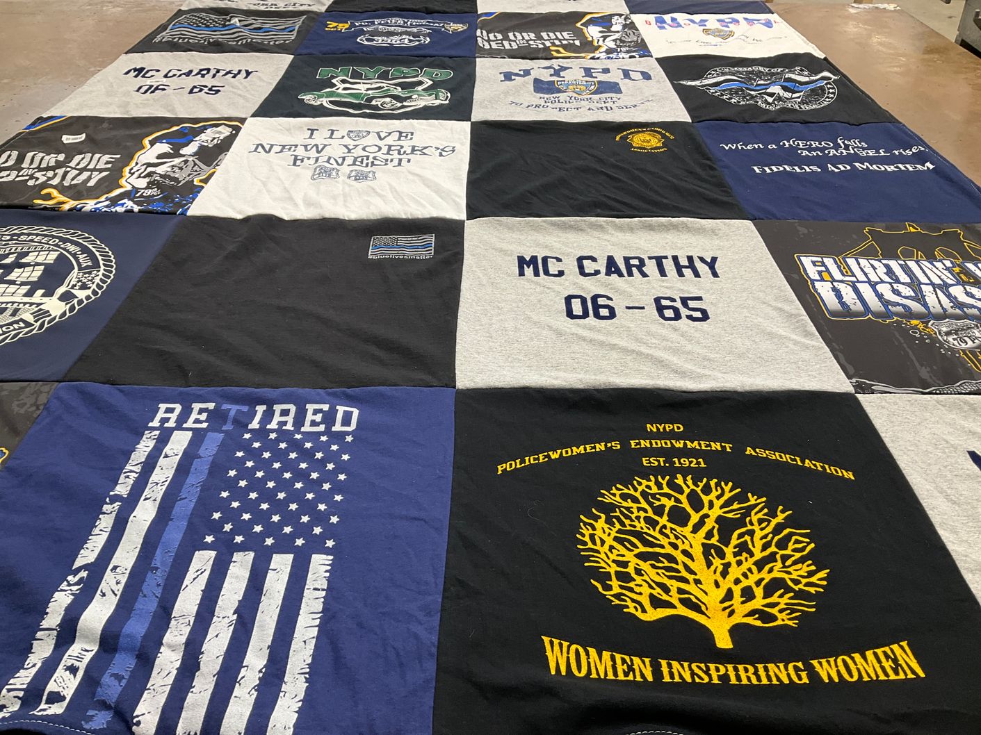 T-shirt quilt with law enforcement, firefighting themes by Sandra from FL