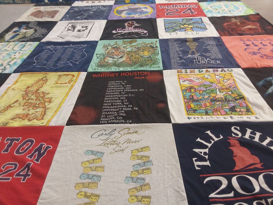 T-shirt quilt with music, travel themes by Barbara from MA