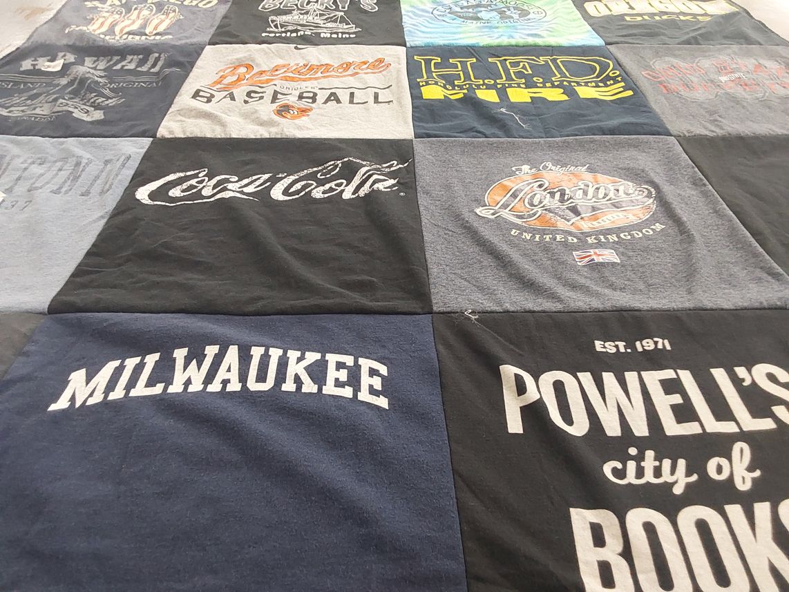 T-shirt quilt with travel, sports themes by Rebecca from OK