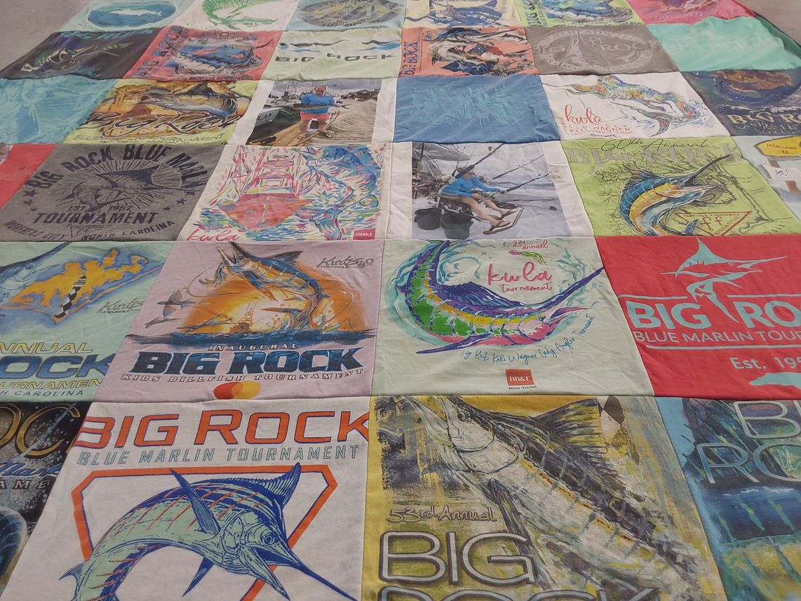 T-shirt quilt with fishing, sporting events themes by Jessica from NC