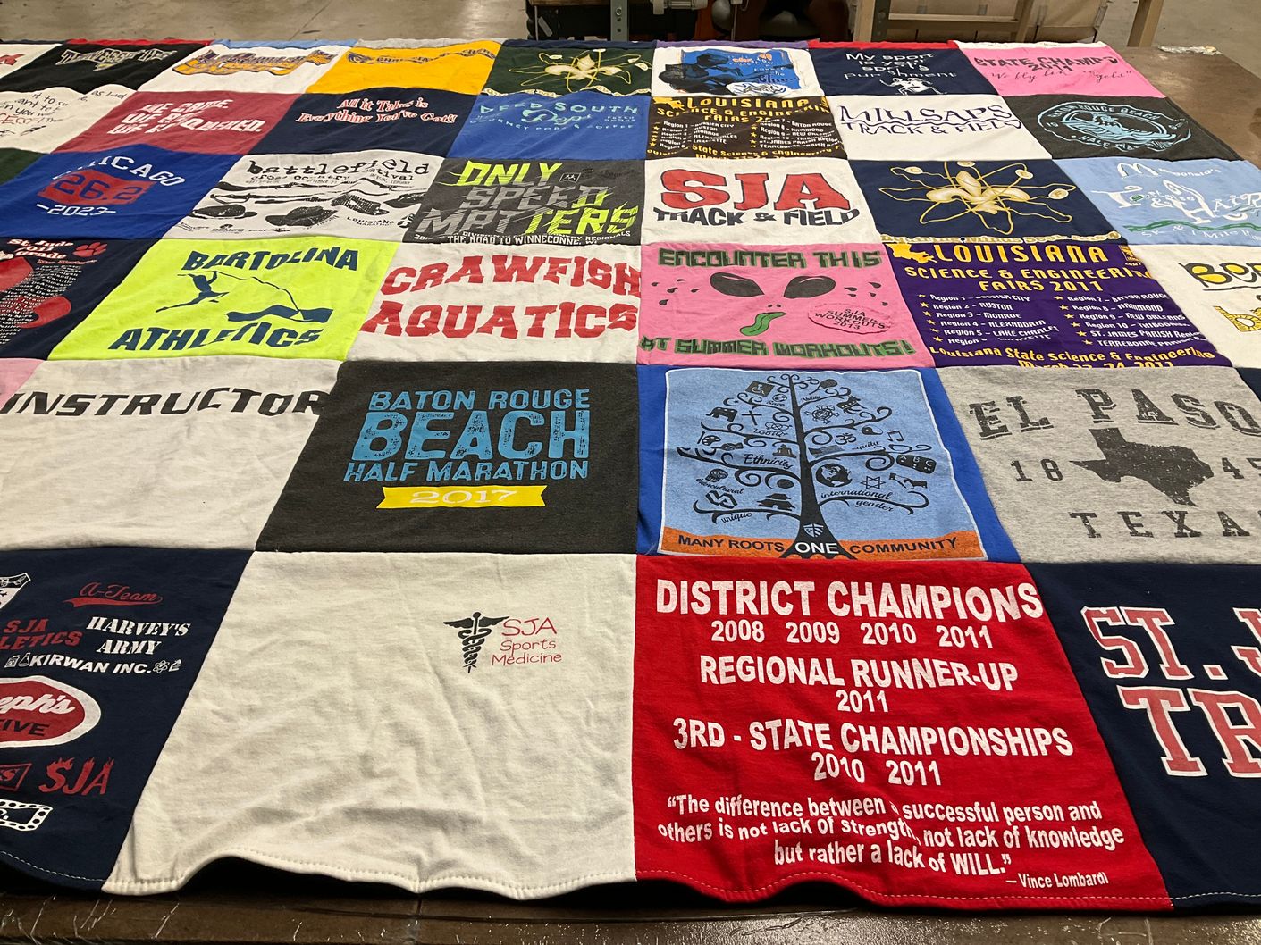 T-shirt quilt featuring sja track and field by Laura from LA