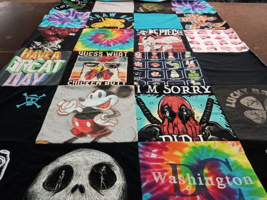 T-shirt quilt with cartoons, pop culture themes by Elizabeth from AZ
