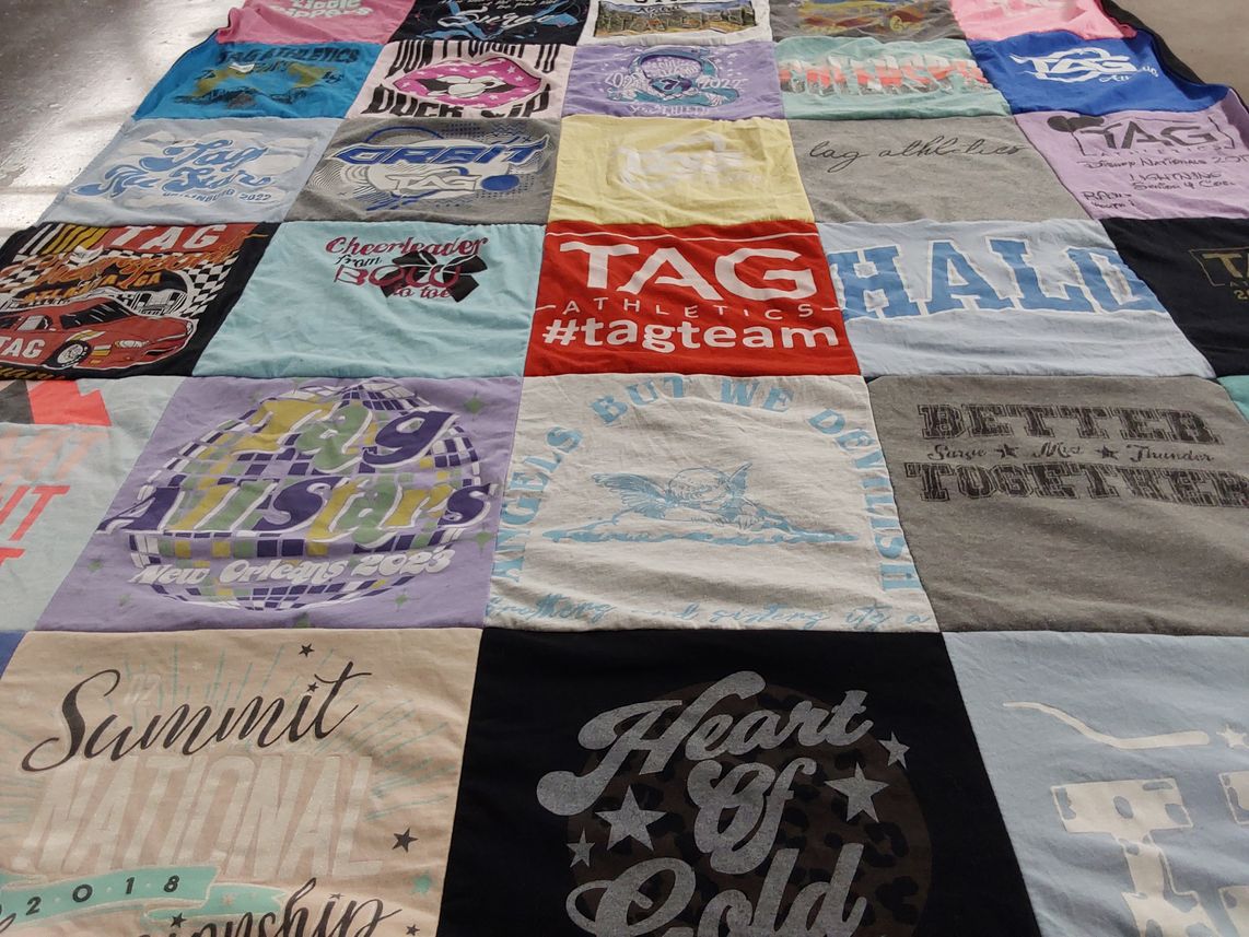 T-shirt quilt with cheerleading, sports themes by Kelly from GA