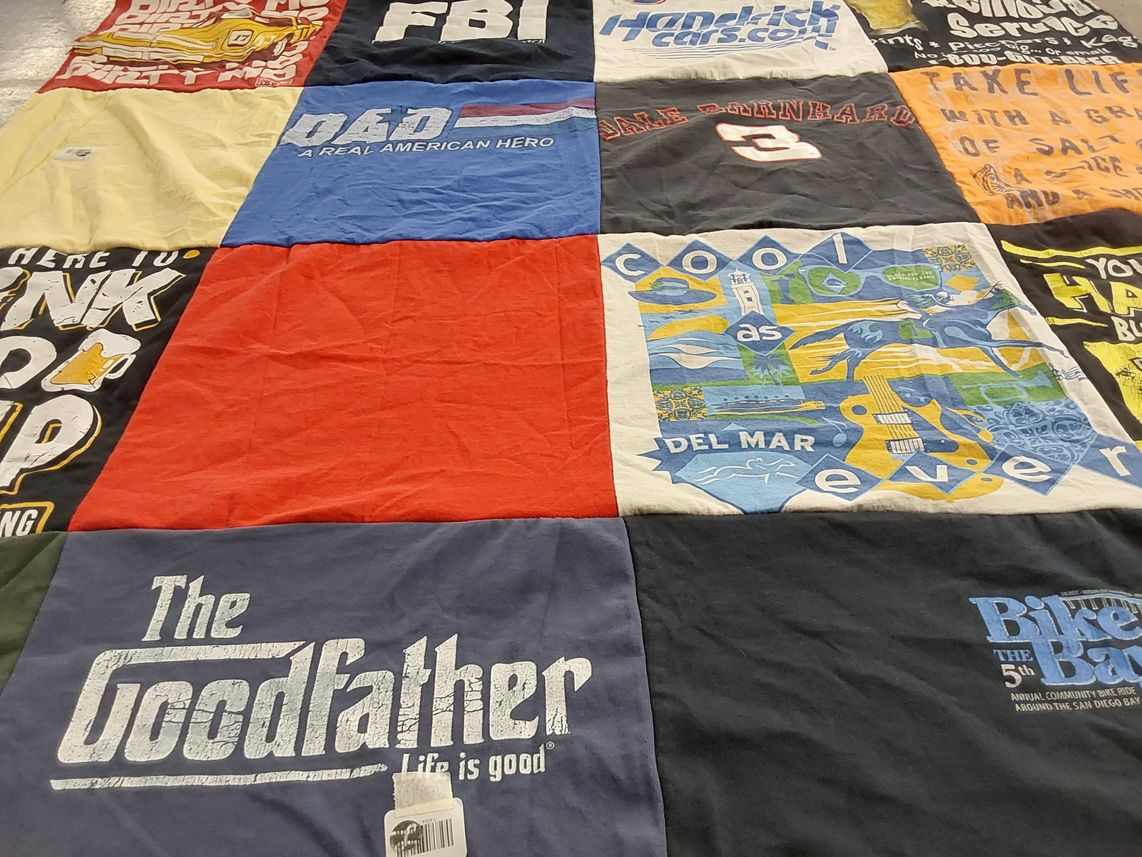 T-shirt quilt with biking, movie themes by Karen from AZ