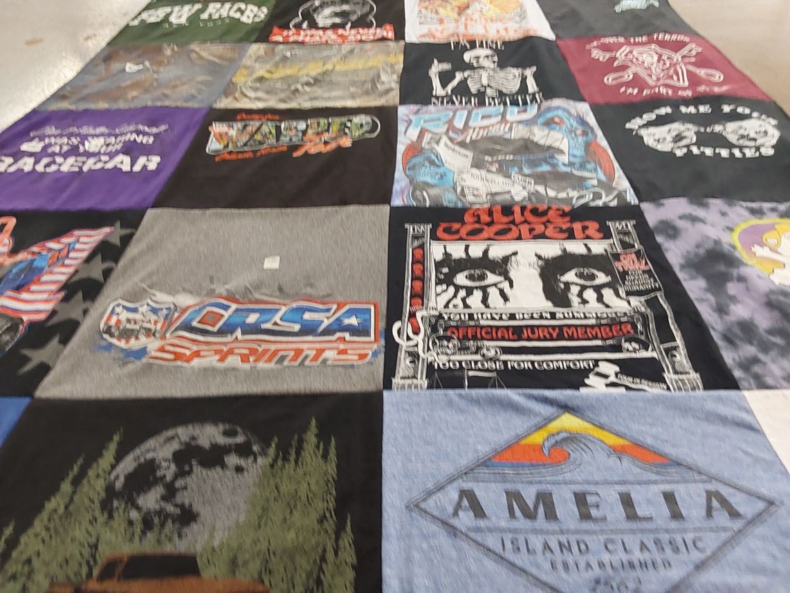 T-shirt quilt with racing, music themes by Hilary from NY