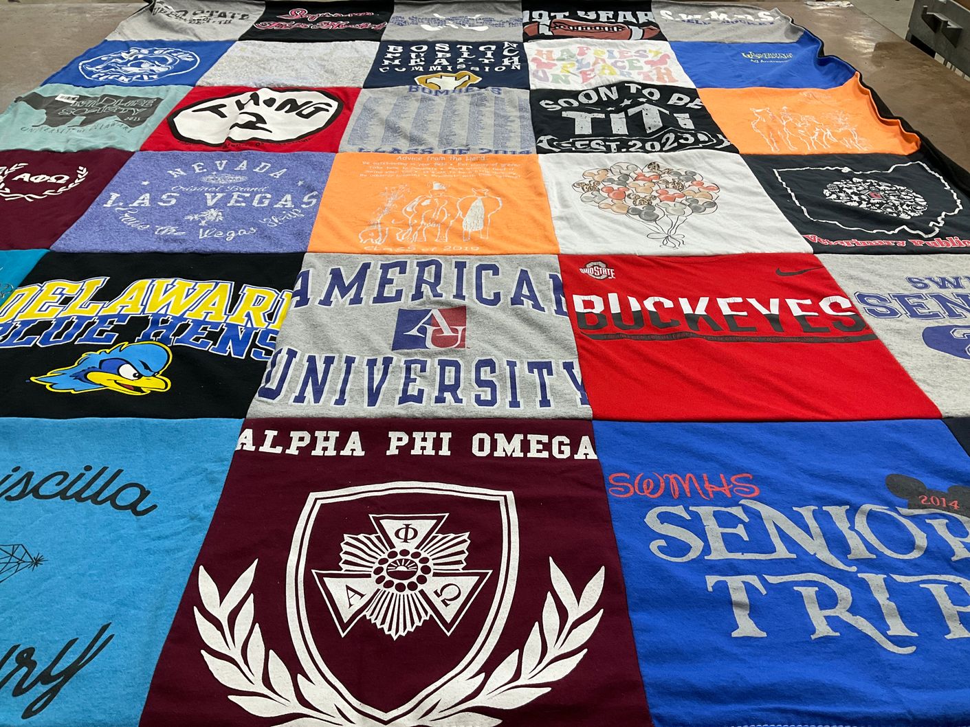 T-shirt quilt featuring delaware blue hens, ohio state buckeyes by Samuel from MA