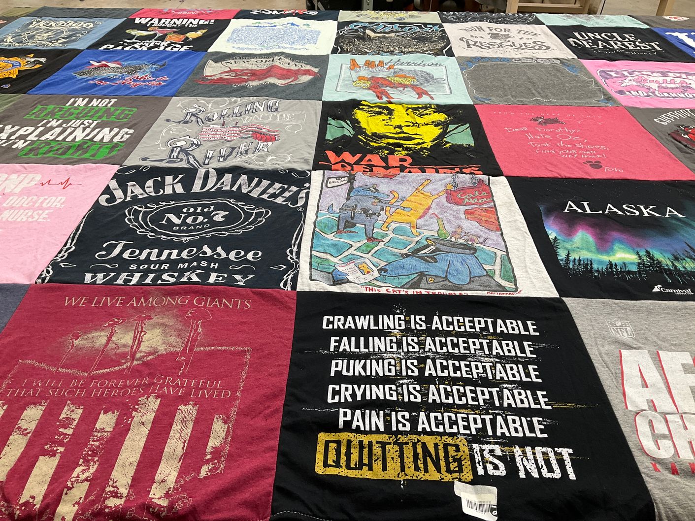 T-shirt quilt with whiskey, alaska themes by Valerie from CA