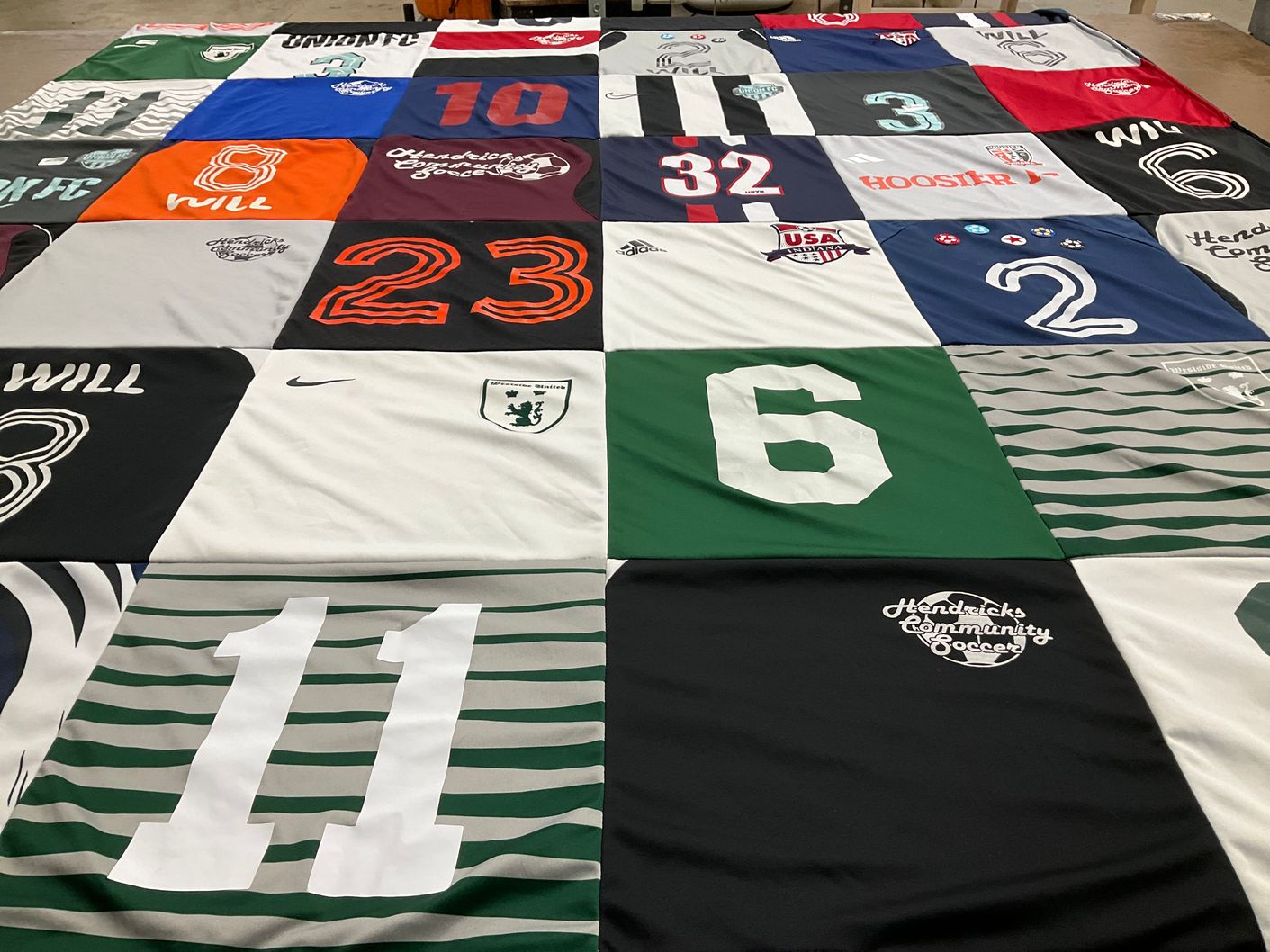 T-shirt quilt with soccer themes by Michelle from IN