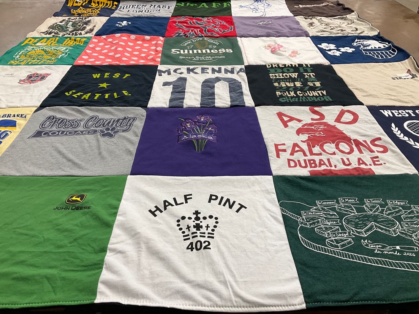 T-shirt quilt featuring cross county cougars, american school of dubai falcons by Jeana from WA