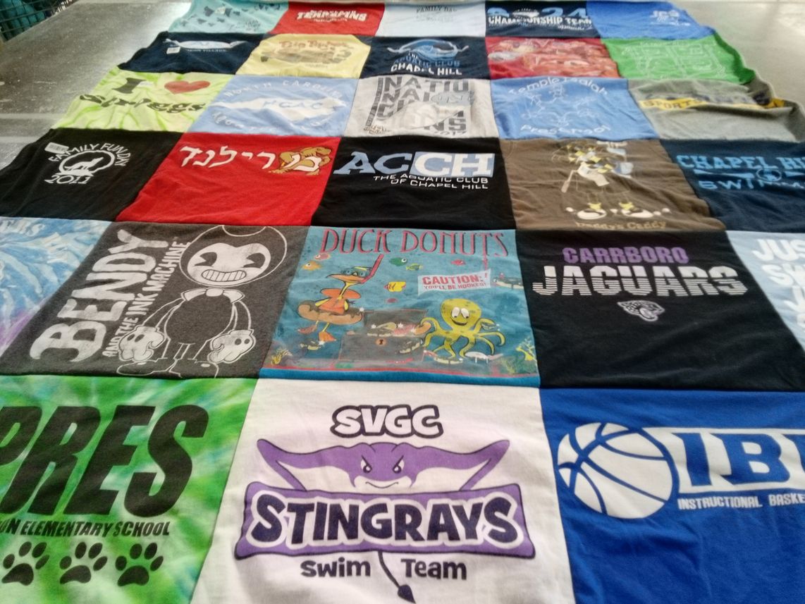 T-shirt quilt featuring svgc stingrays swim team, carrboro jaguars by LISA from NC