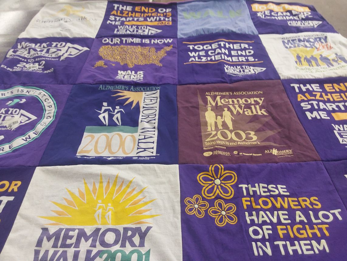 T-shirt quilt with health, awareness themes by Carol from CO