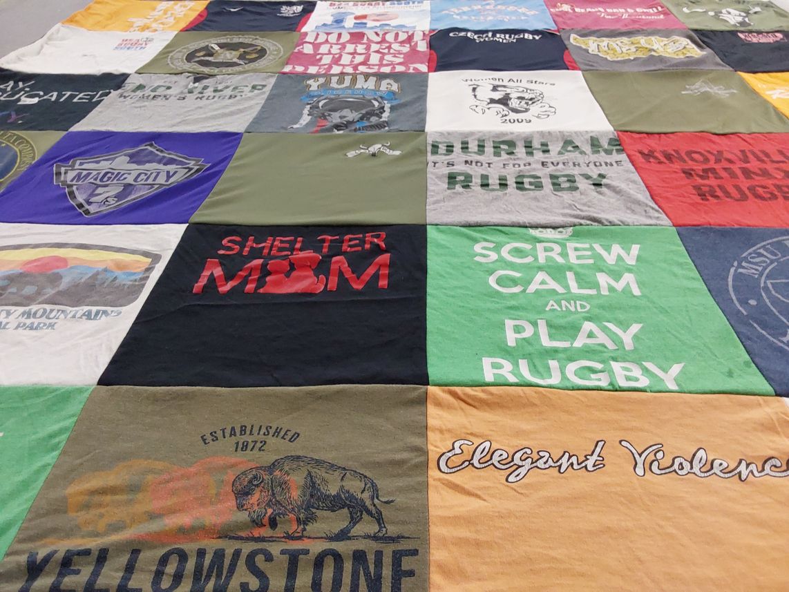 T-shirt quilt with rugby, outdoors themes by Marie from TN