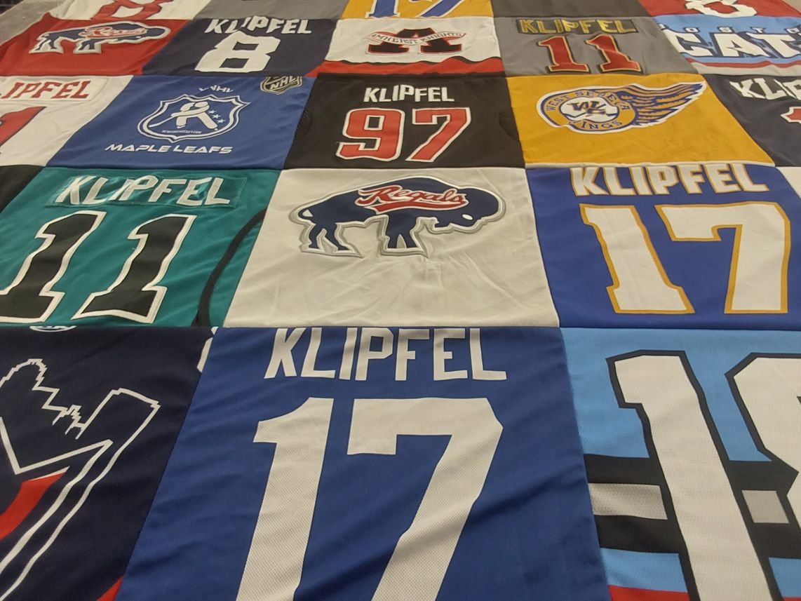 T-shirt quilt with hockey themes by Rita from NY