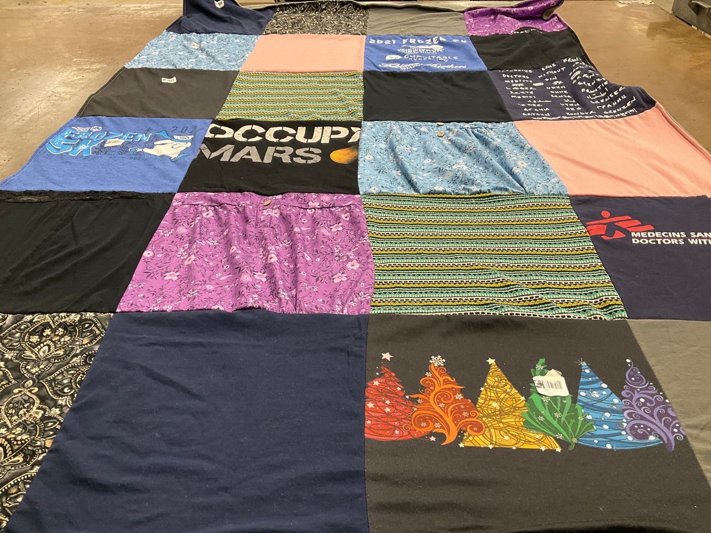T-shirt quilt with space, humanitarian aid themes by Zayda from MI