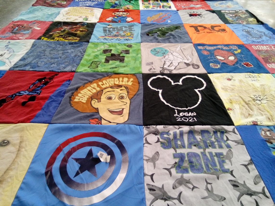 T-shirt quilt with cartoons, superheroes themes by Lisa from CA