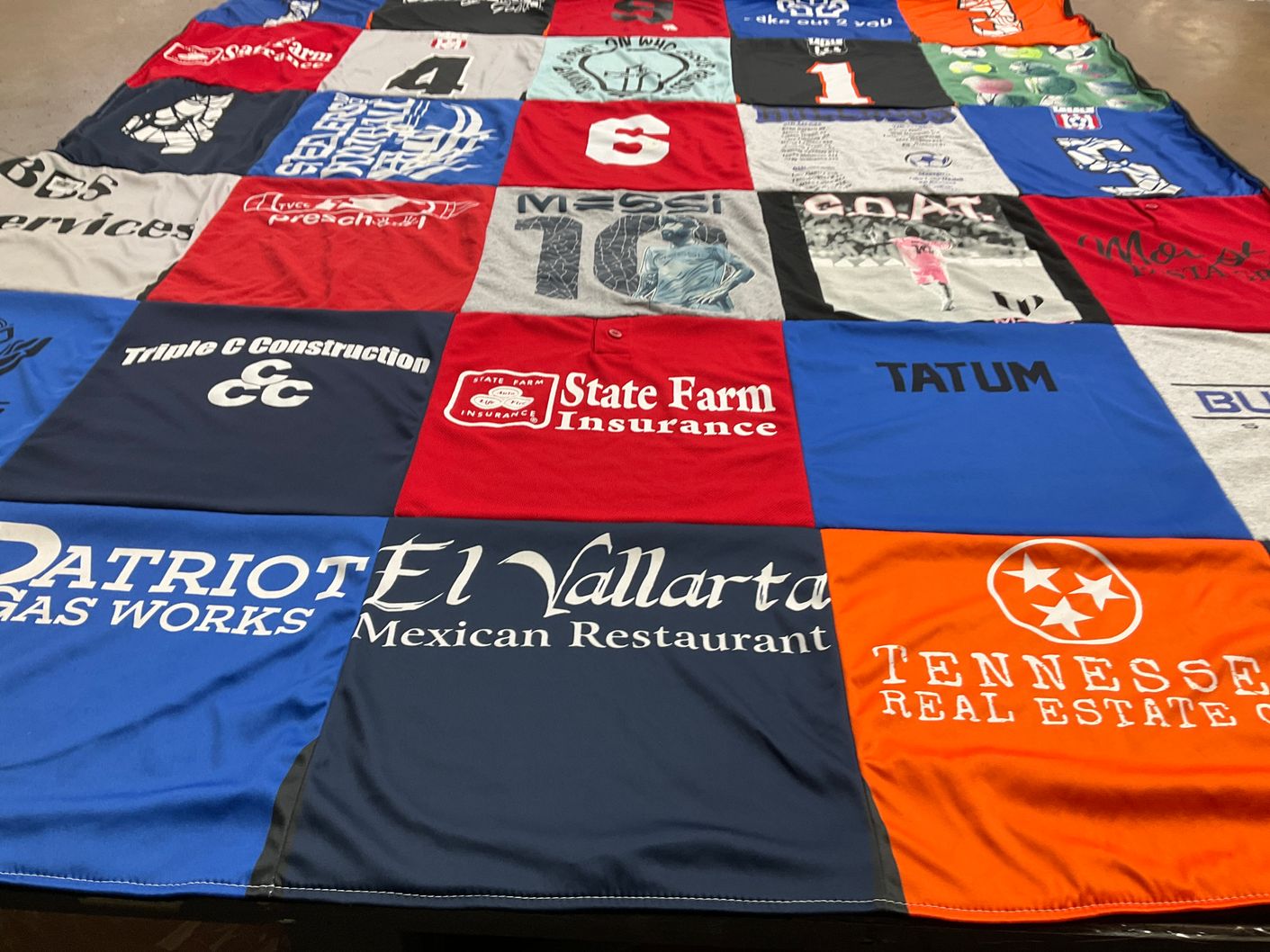 T-shirt quilt with restaurants, insurance themes by Jennifer from TN