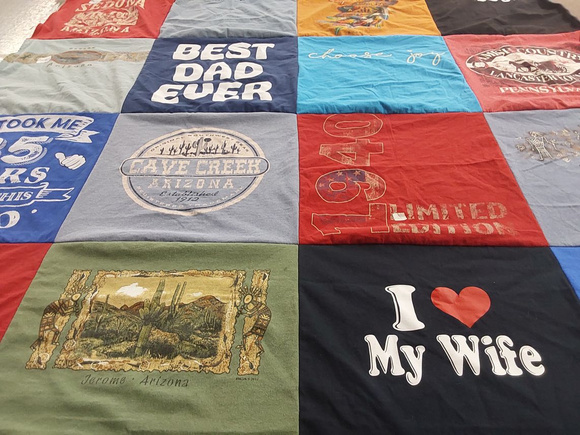 T-shirt quilt with travel, family themes by Joetta from NY
