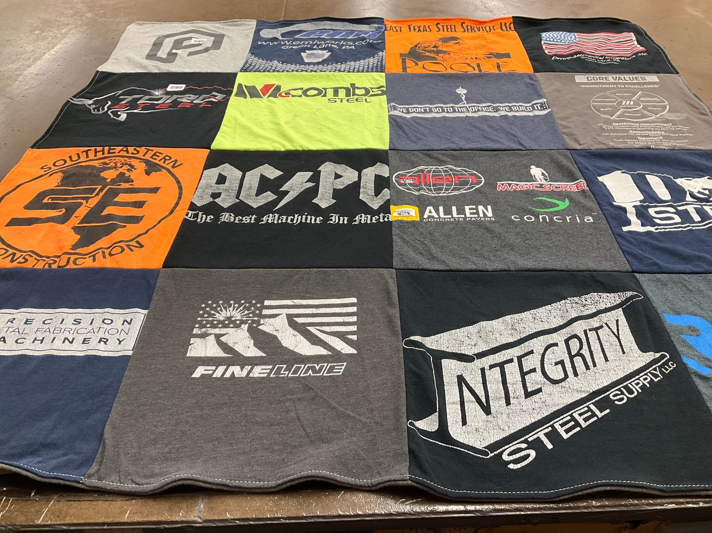 T-shirt quilt with engineering, manufacturing themes by Rebecca from NH