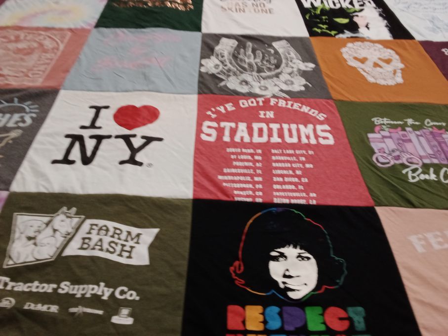 T-shirt quilt with travel, music themes by Amanda from LA