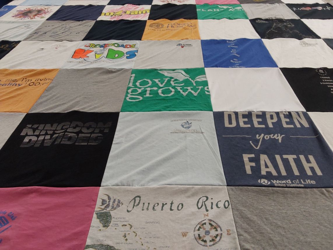 T-shirt quilt with volunteering, bible study themes by Miriam from FL