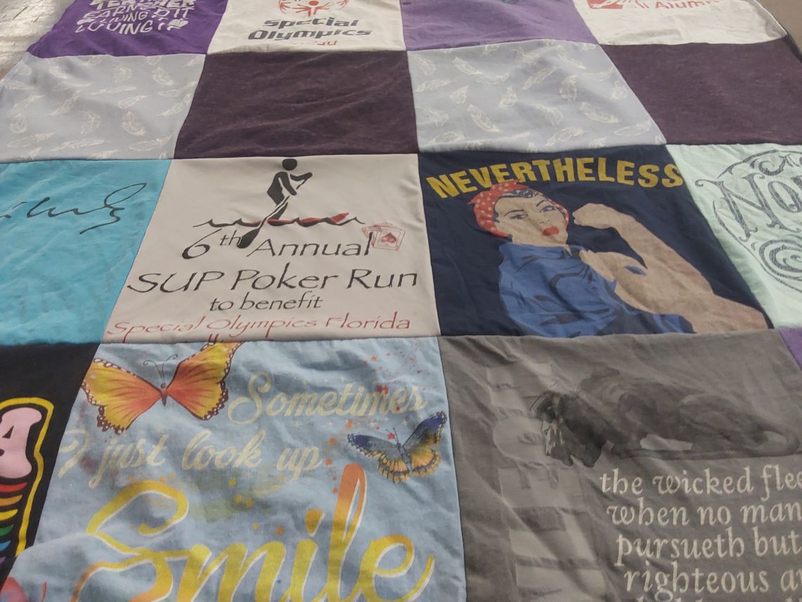 T-shirt quilt with charitable events, activism themes by Amy from GA