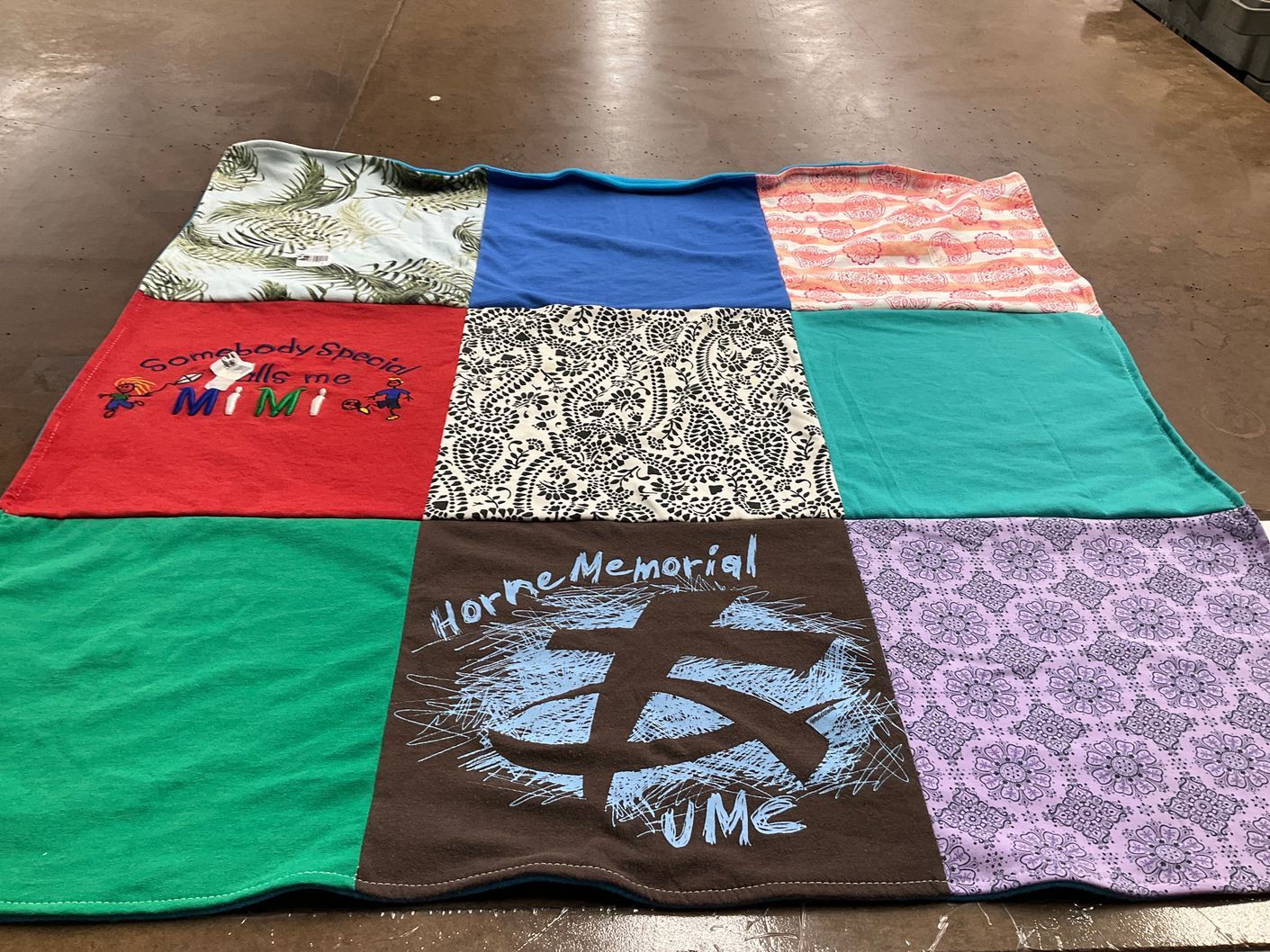 T-shirt quilt with family themes by Nancy from NC