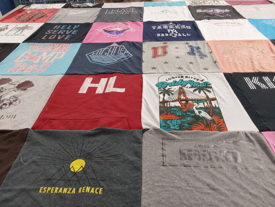 T-shirt quilt with community service, sports themes by Dawn from SC