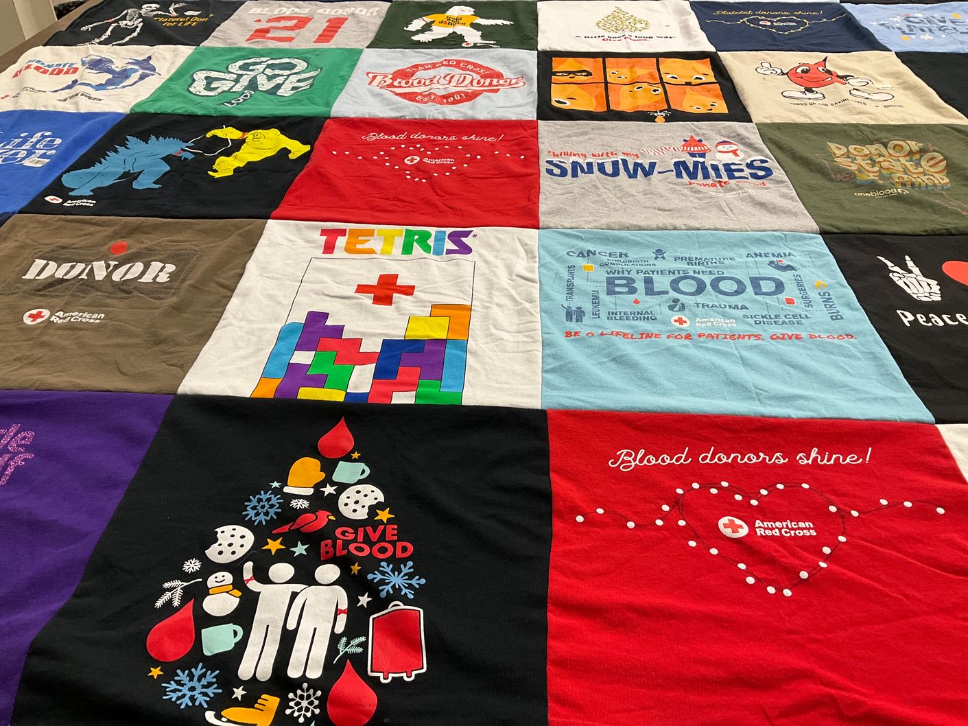T-shirt quilt with blood donation, charity themes by Darcy from NC