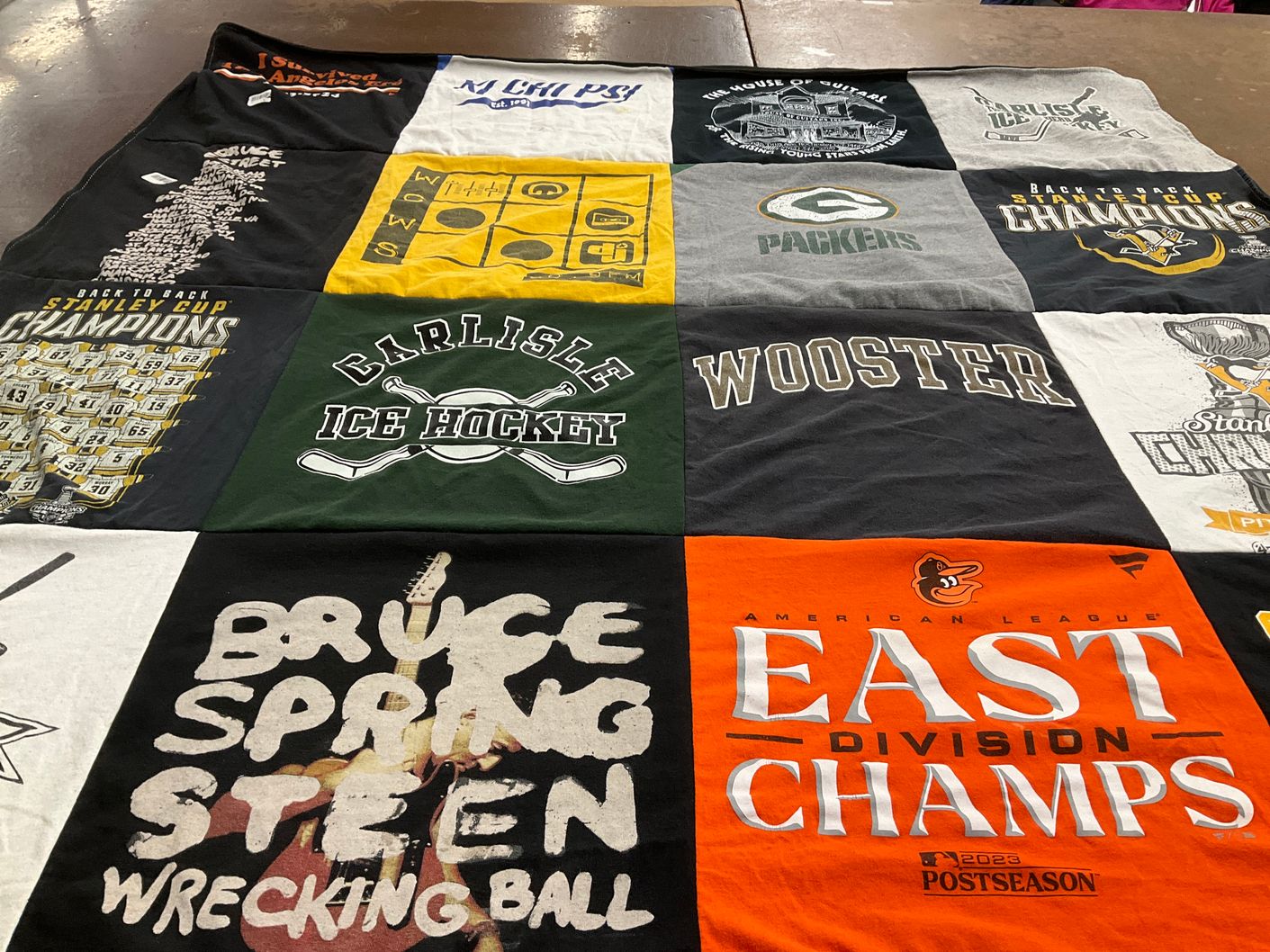T-shirt quilt featuring green bay packers, pittsburgh penguins by Brianna from WA