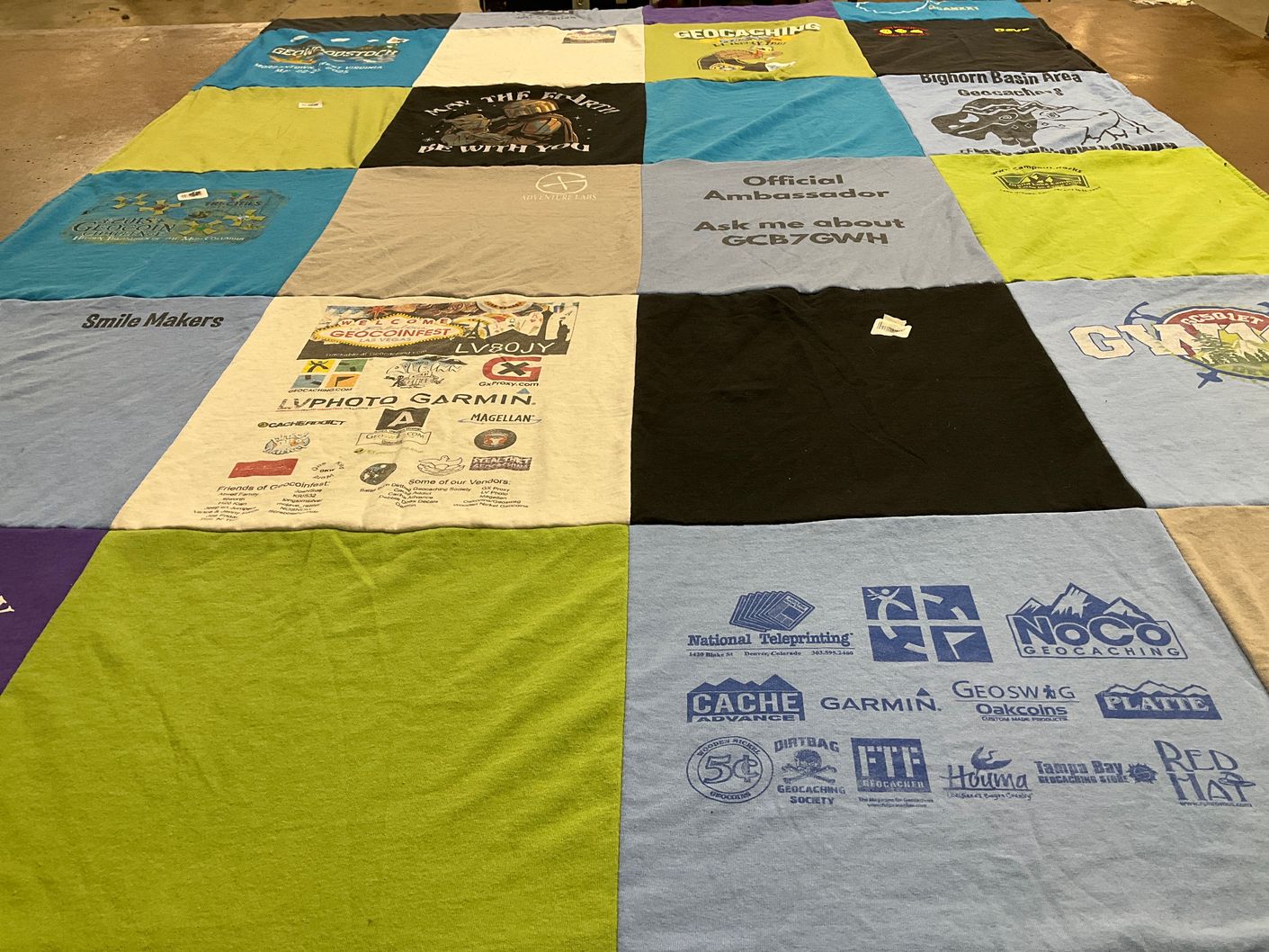 T-shirt quilt with geocaching, outdoor activities themes by Jenny from WY