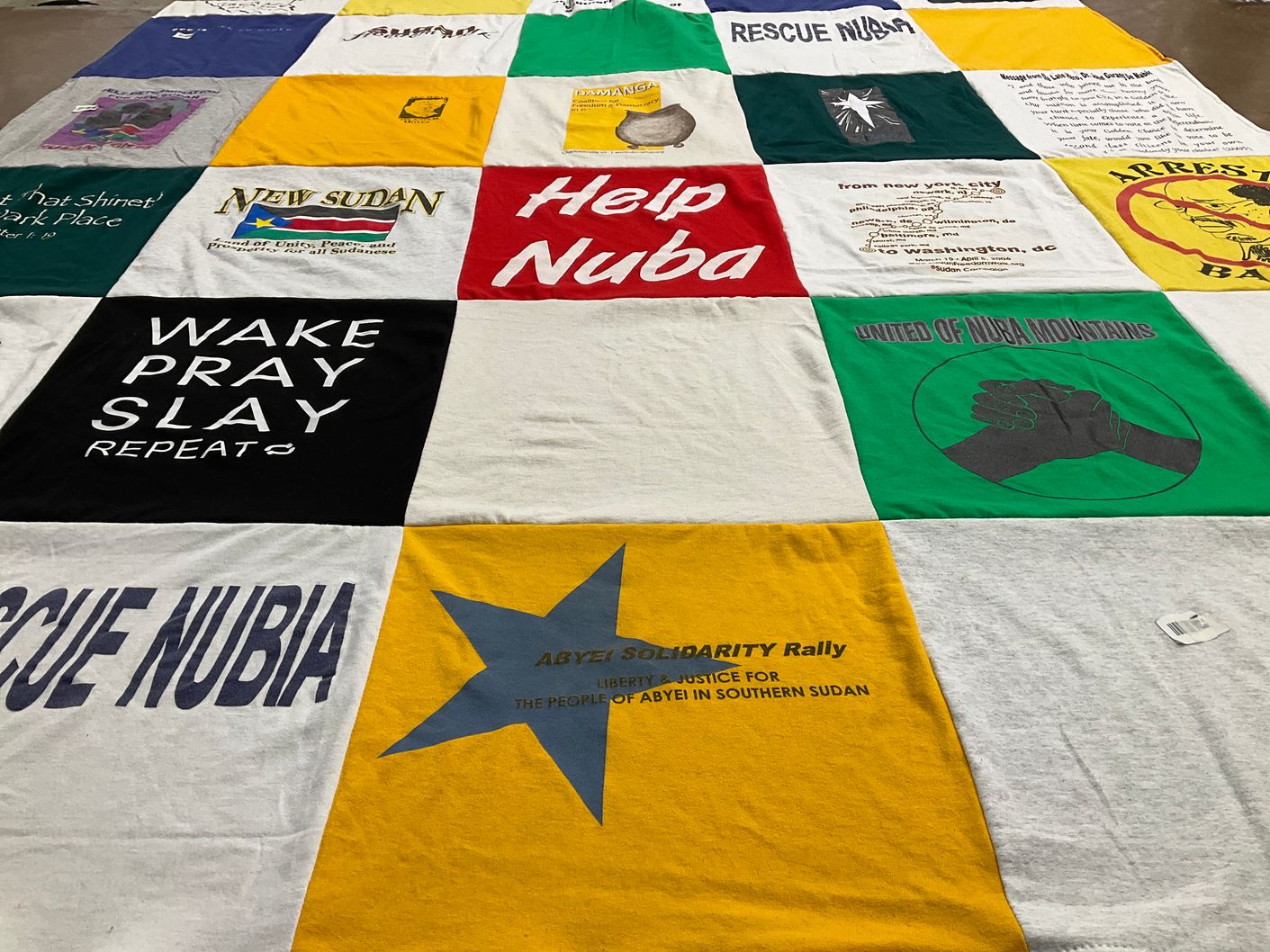 T-shirt quilt with advocacy, human rights themes by Faith from VA