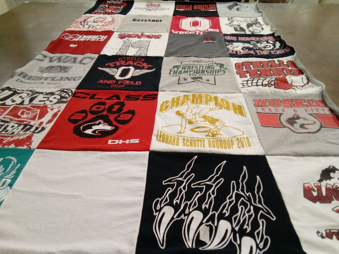 T-shirt quilt featuring oto wrestling, huskies track and field by Maureen from WA