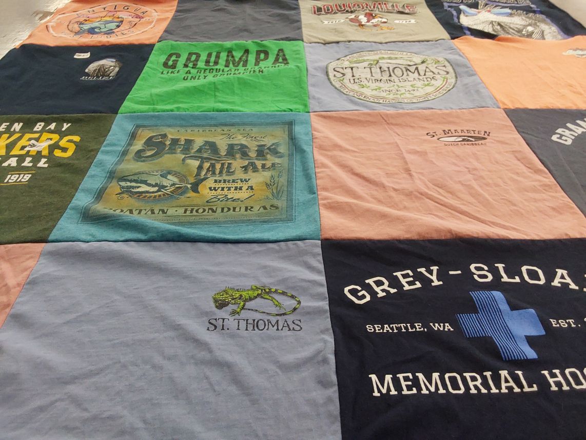 T-shirt quilt with fishing, travel themes by Sami from KY