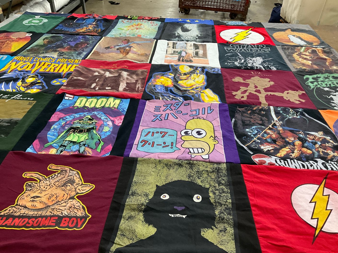 T-shirt quilt with comics, music themes by Lynda from MD