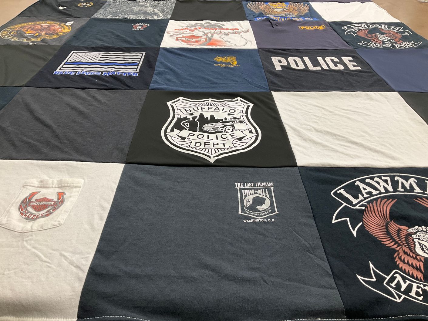 T-shirt quilt with law enforcement, motorcycling themes by Nancy from NY