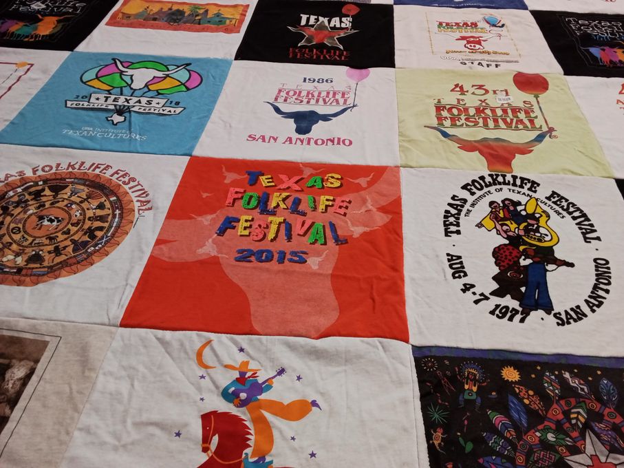 T-shirt quilt with folk festival, texas culture themes by Jo from TX