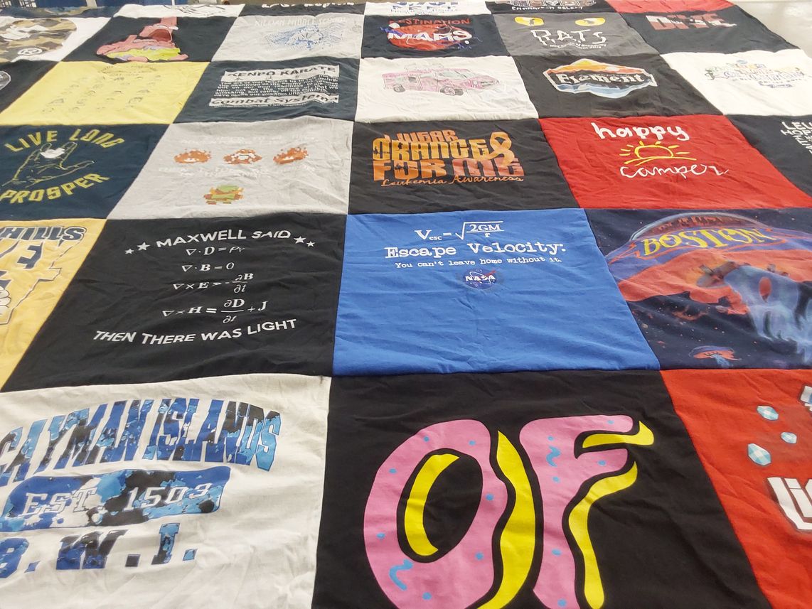 T-shirt quilt with science, math themes by Shelley from TX