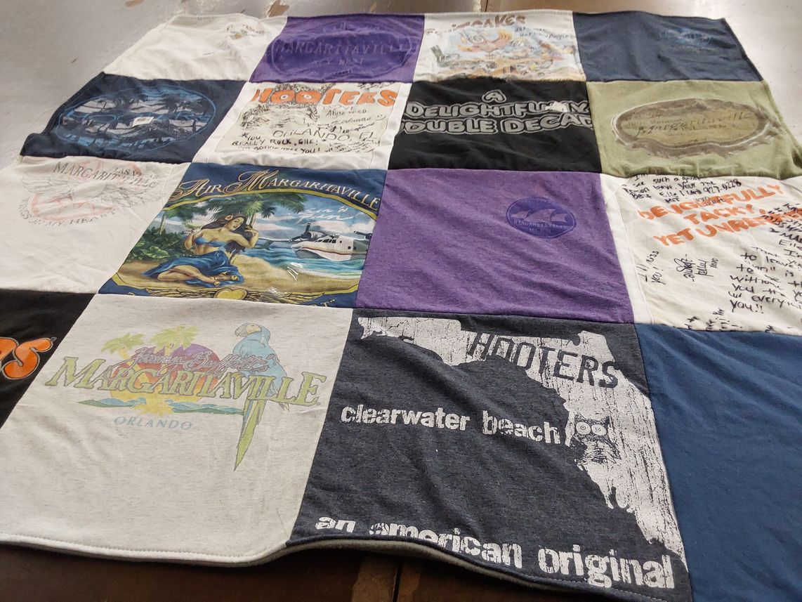 T-shirt quilt with beach, restaurants themes by Ellen from NC
