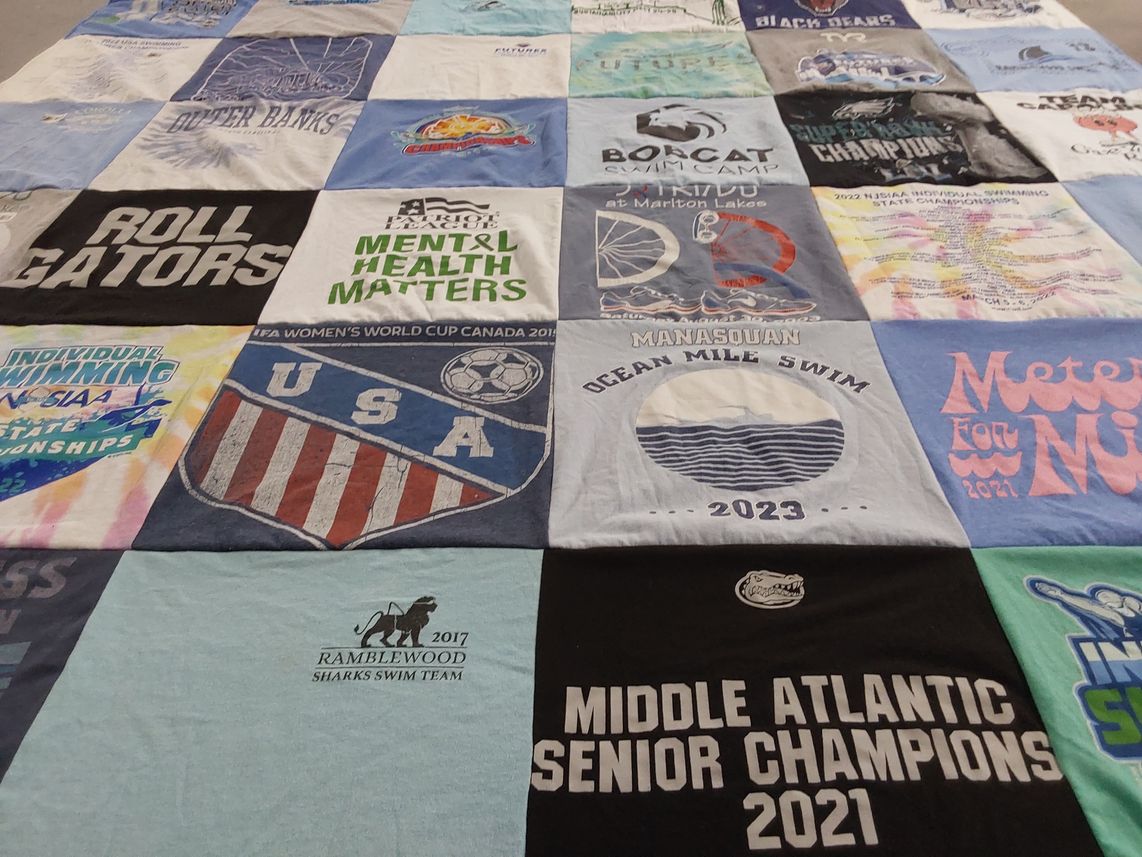 T-shirt quilt featuring sharks swim team by Heather from NJ