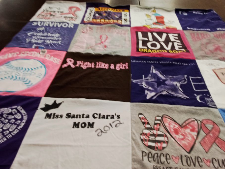 T-shirt quilt with breast cancer awareness, community support themes by Elizabeth from CA