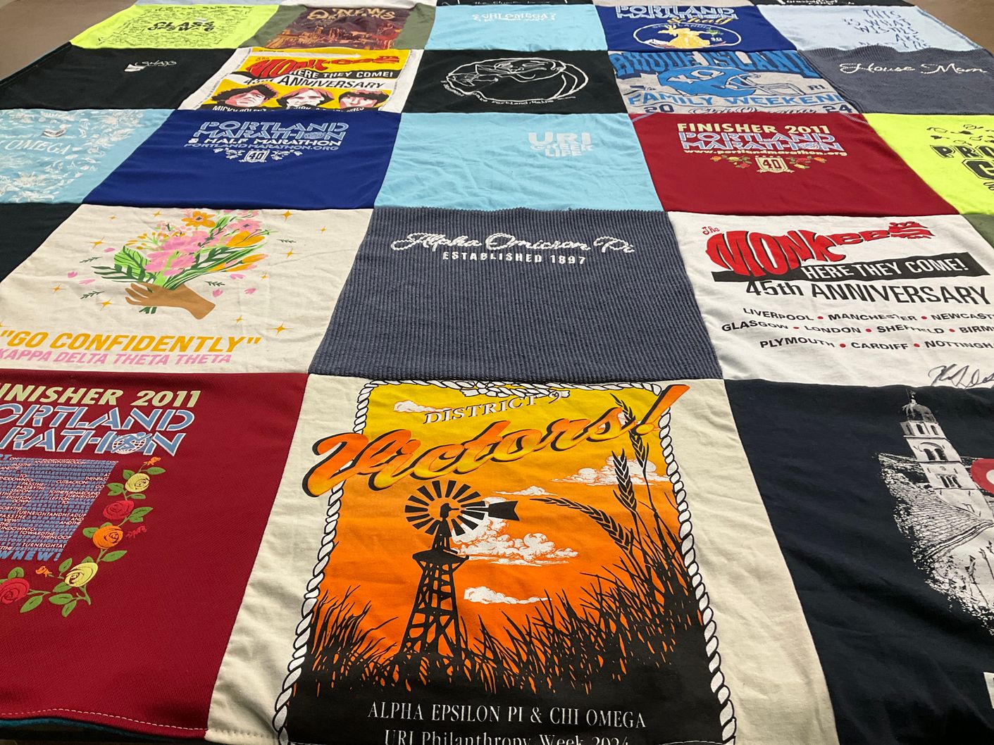 T-shirt quilt with marathons, fraternities themes by Lynn from ME