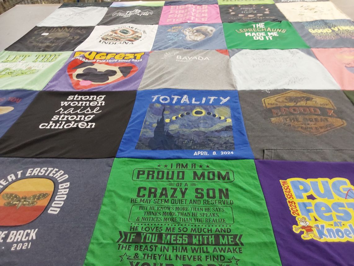 T-shirt quilt with pugs, women's empowerment themes by Kathleen from PA