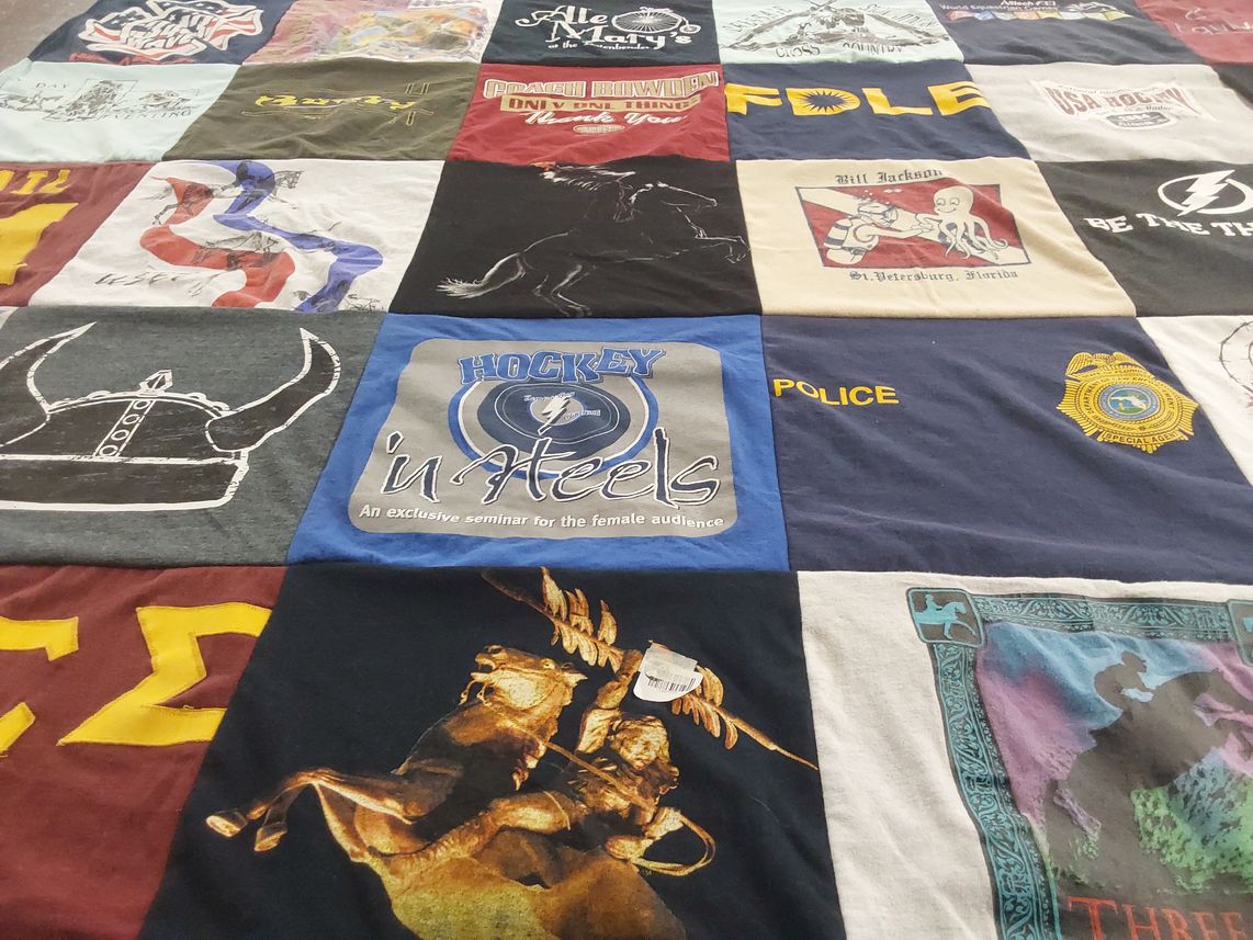T-shirt quilt with hockey, law enforcement themes by Gail from FL